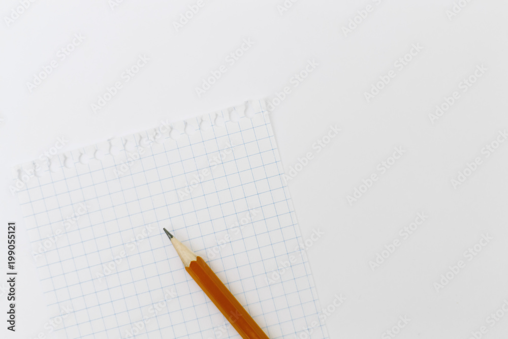 Blank white paper with pencil on a white desk. High quality graphic collage. Blank white paper with pencil on a white desk. High quality graphic collage.