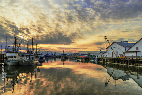 fishing boats and boats on the dock in the summer evening © Viktor Birkus