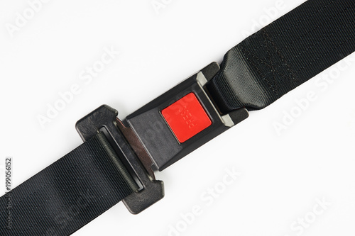 Fastened seat belt isolated on white background, close-up. Safety concept