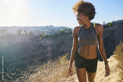 athletic african american woman walking runyon canyon