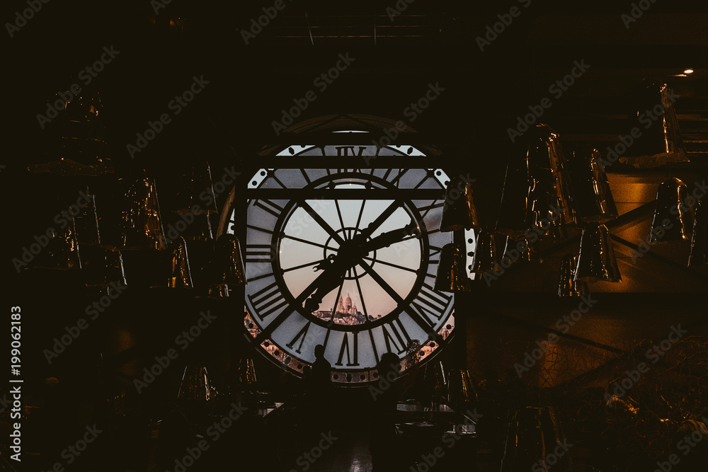 view of montmartre and Sacre Coeur  through clock window at Musee d'Orsay