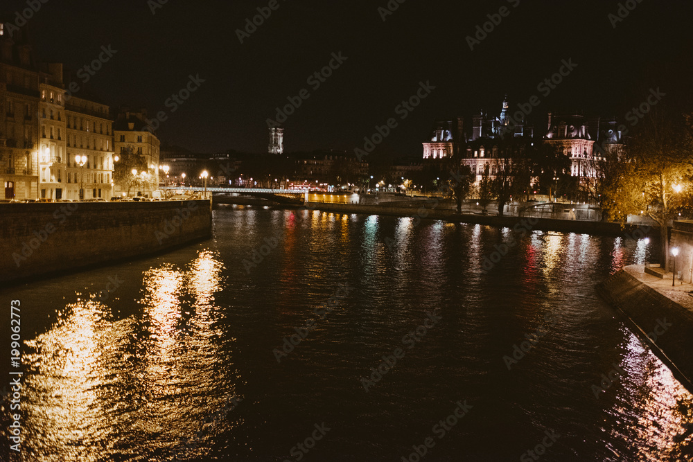 Paris river seine at night with reflection of lights