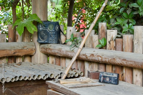 Abandoned bamboo hut with two retro vintage audio sound systems