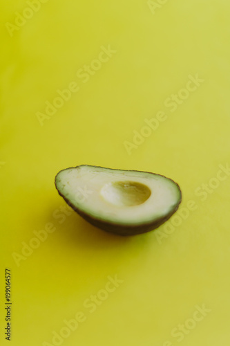 avocado on yellow background