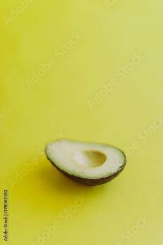 avocado on yellow background