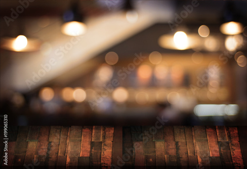 Wooden board empty table  cafe, coffee shop, bar blurred background can be used for display or montage your products and Mock up