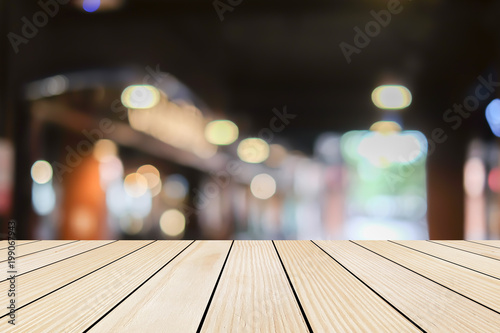 old vintage grungy brown wood panel tabletop with blurred restaurant bar cafe light color background for show,promote and advertise product on display