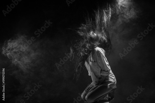 broken heart lonely girl can cry, smoke Fog on dark Background photo