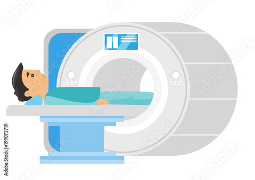 Young frightened caucasian white man undergoes a magnetic resonance imaging scan test
