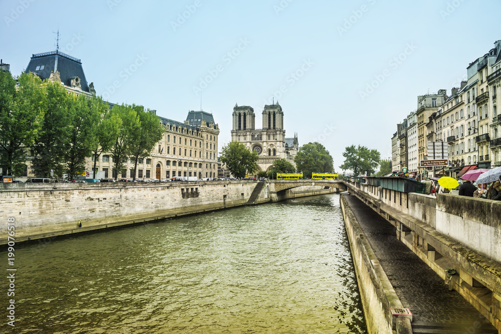 Seine river and main Facade of Notre Dame de Paris Cathedral, Paris, France