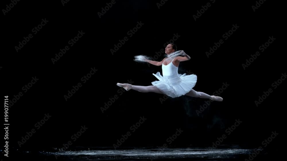 Ballerina performing on black background spinning slow motion Ballerina performing on black background spinning slow motion