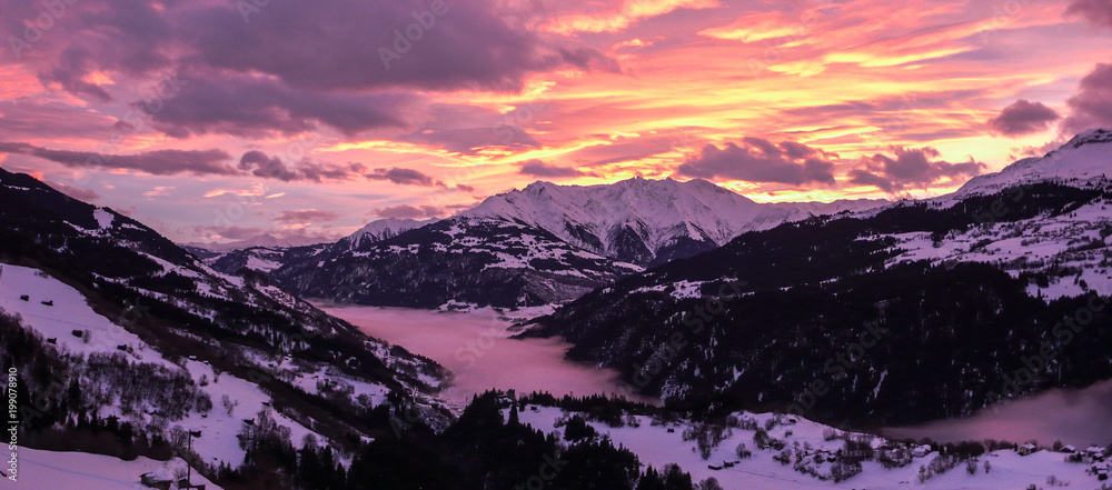 Obraz premium majestic and colorful sunset over a winter mountain landscape in the Alps