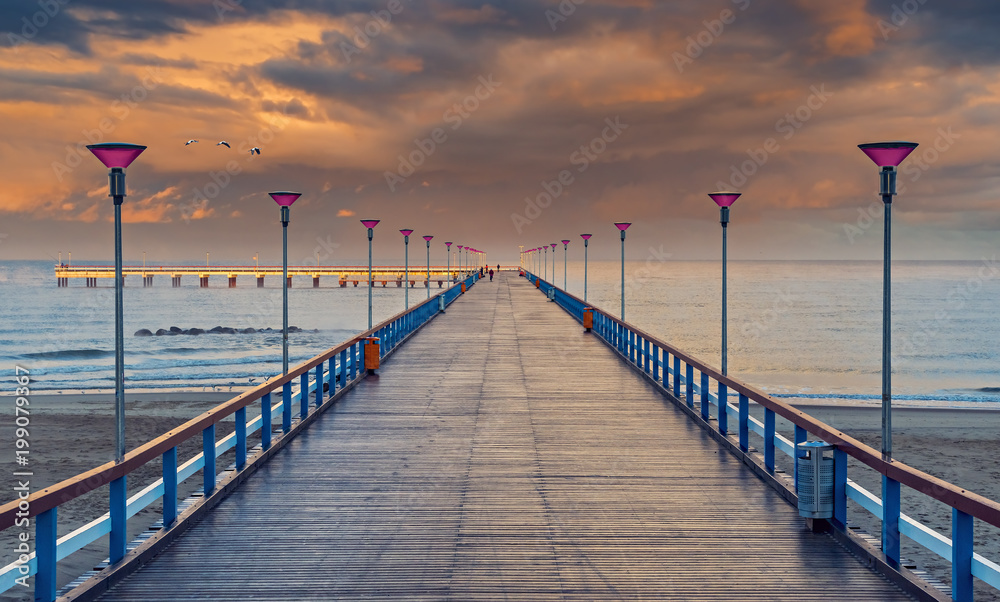 Autumnal seascape with a walking pier, Baltic Sea