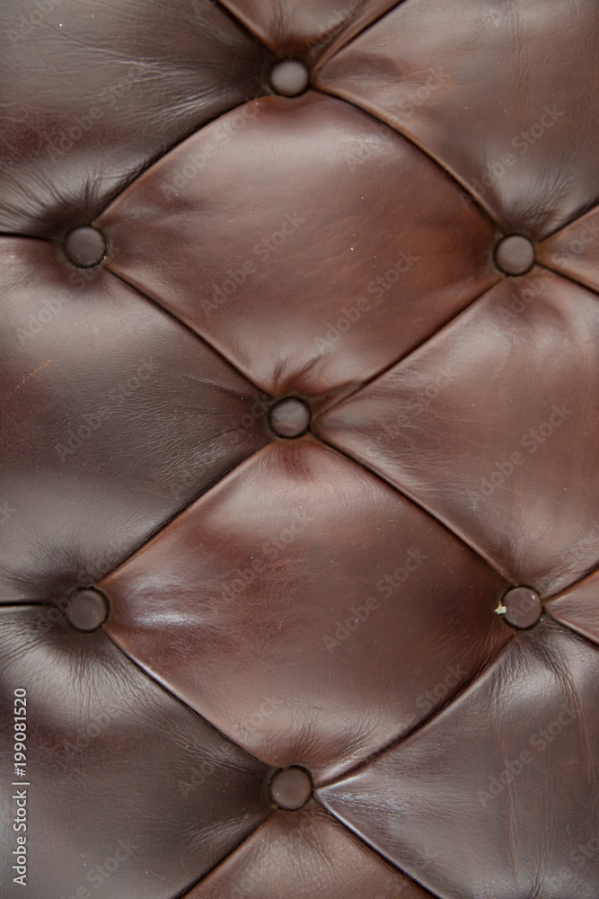 Obraz premium Brown leather sofa texture background.