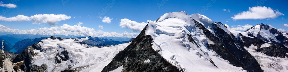 panoramic view of the Val Poschiavo and Piz Palu in the Bernina mountains as seen from the summit of Piz Cambrena