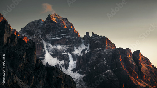 Spectacular mountain view during sun rising with a little snow - Dolomite Mountains Italy