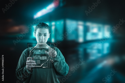 Young woman working on digital pad.