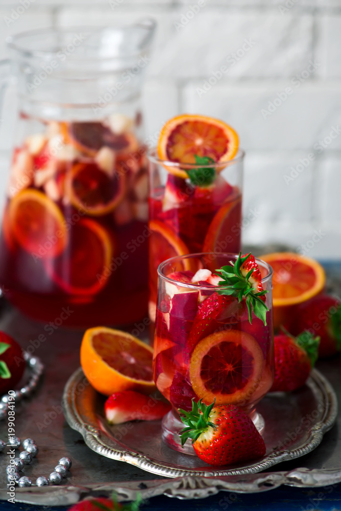 BLOOD ORANGE VANILLA BEAN ROSE SANGRIA in glasses. BLOOD ORANGE VANILLA BEAN ROSE SANGRIA in glasses.