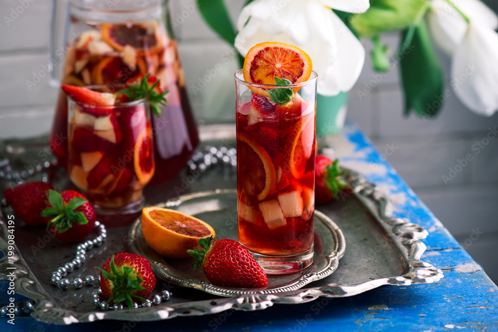 BLOOD ORANGE VANILLA BEAN ROSE SANGRIA in glasses. BLOOD ORANGE VANILLA BEAN ROSE SANGRIA in glasses.