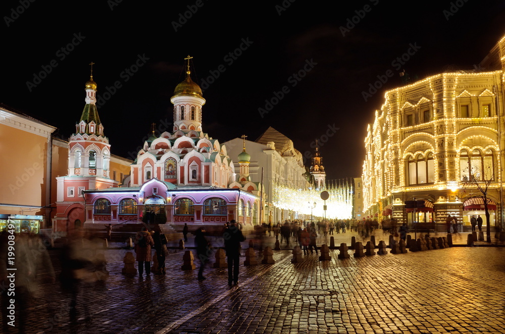 The Church in the name of Kazan Icon of mother of God on Red square and Nikolskaya street on a winter evening, Moscow, Russia