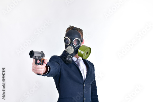 Business Concepts. Businessman wearing a gas mask on a white background. Businessmen wear gas masks as bad guys. Businessmen wear gas masks to prevent pollution and toxins.