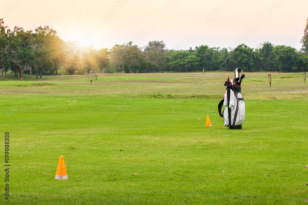 Golf equipment.Professional golf gear on the golf course at morning time with sun. Golf equipment.Professional golf gear on the golf course at morning time with sun.