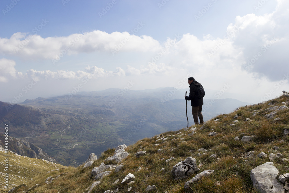 hiker on mountain peak on matese park