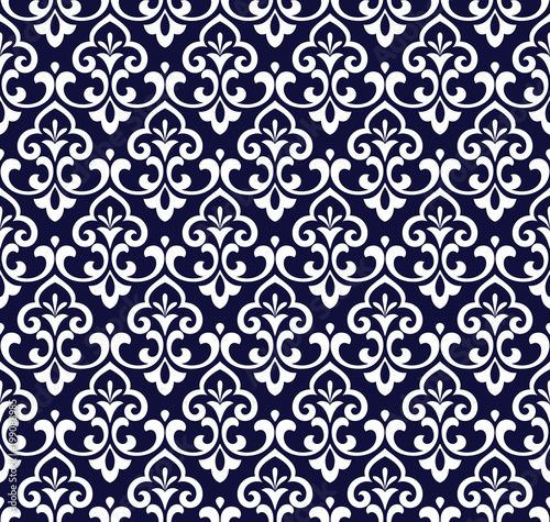 Wallpaper in the style of Baroque. A seamless vector background. Blue and gold floral ornament. Graphic vector pattern