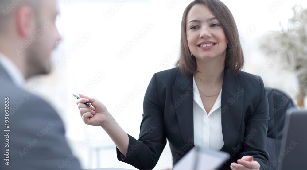 Business people working together at the desk in the office Business people working together at the desk in the office