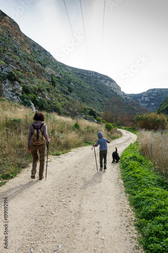 Mother and son trekking, Greece