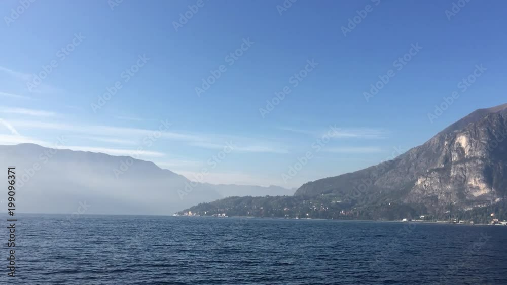 Como lake in Italy. Panoramic view from water surface. morning sunrise. Como lake in Italy. Panoramic view from water surface. morning sunrise.