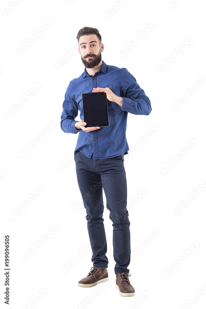 Friendly smiling bearded business man holding tablet in both hands and showing it at camera. Full body isolated on white background. Friendly smiling bearded business man holding tablet in both hands and showing it at camera. Full body isolated on white background.