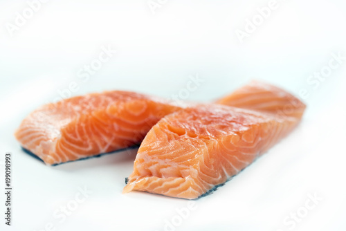 Slices of the fresh salmon on white