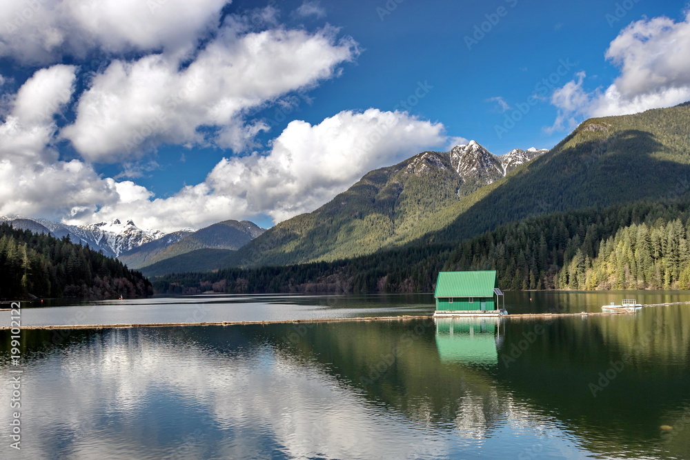 Capilano Reservoir Lake Long Reflection Green Building Dam Snowy  Snow Mountain Vancouver British Columbia Pacific Northwest