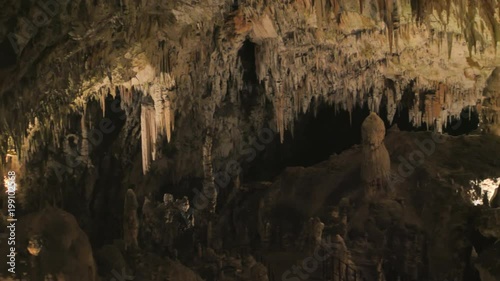 postojna caves interior pan over stalagmites stalactites photo