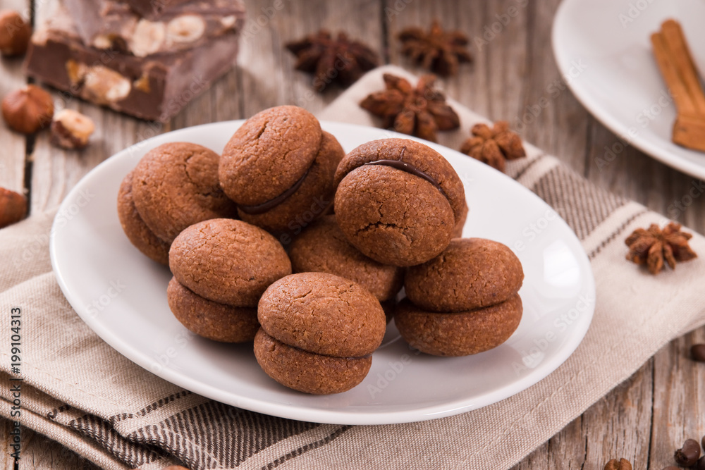 Hazelnut shortbread sandwiches filled with chocolate cream. 
