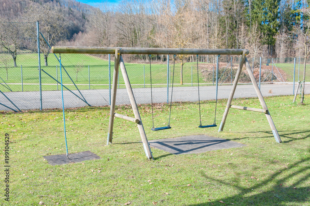 wooden swing on playground
