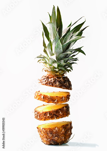 Fresh juicy pineaplle flying on white background