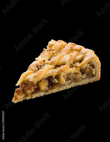 piece of freshly baked apple pie over black background