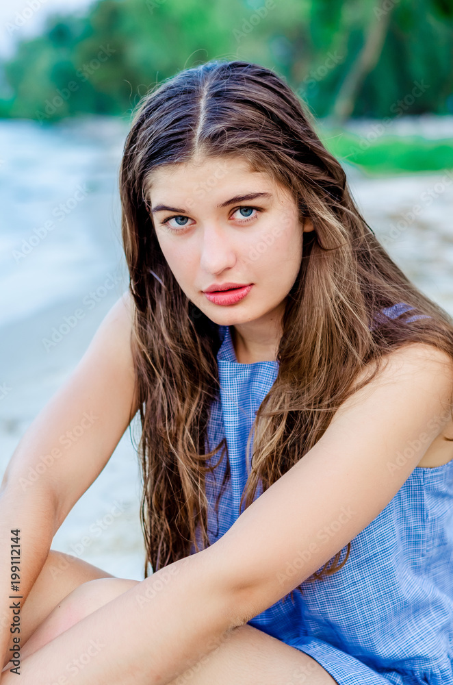 Portrait of a young beautiful girl on vacation. girl with long hair on the background of the sea. Close-up face of a happy girl on island in the ocean. happy girl in a blue dress.
Portrait of a young beautiful girl on vacation. girl with long hair on the background of the sea. Close-up face of a happy girl on island in the ocean. happy girl in a blue dress.