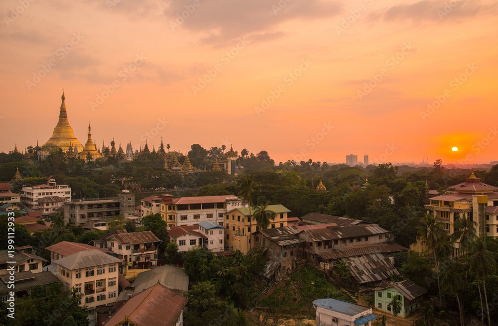 Scenery view of Shwedagon pagoda and Yangon town the largest city in Myanmar during the sunset.