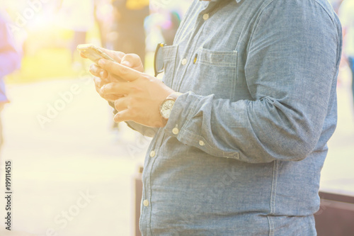 People use mobile phones to connect with social media or their relatives.