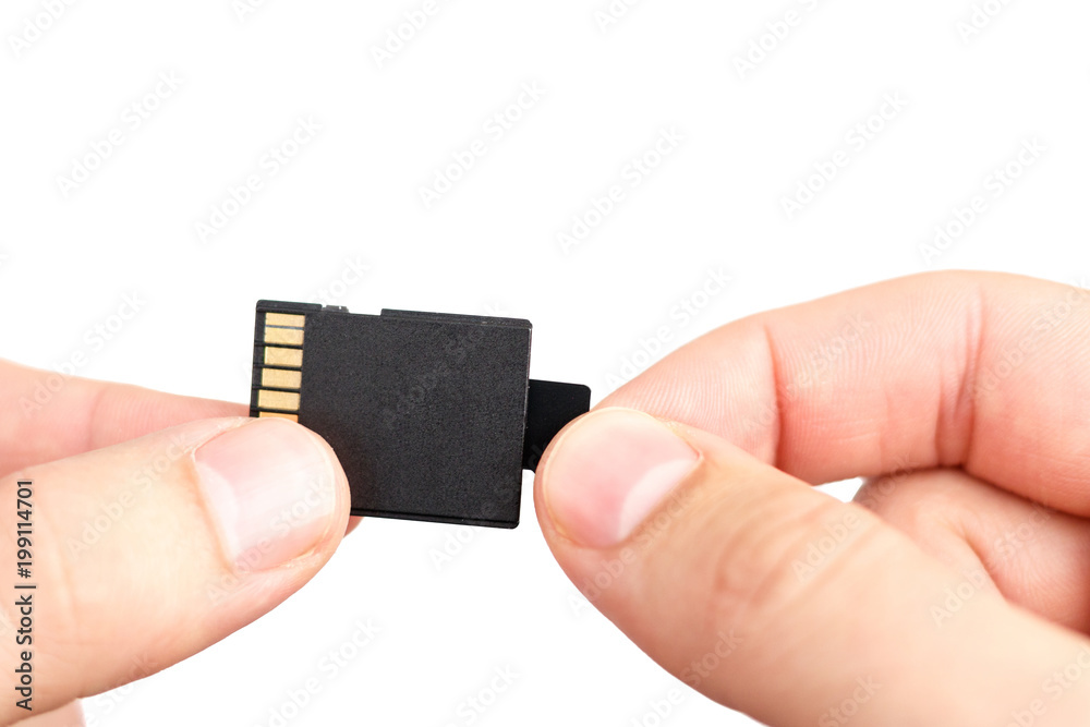 Small Flash card in hand isolated on white background. Small Flash card in hand isolated on white background.