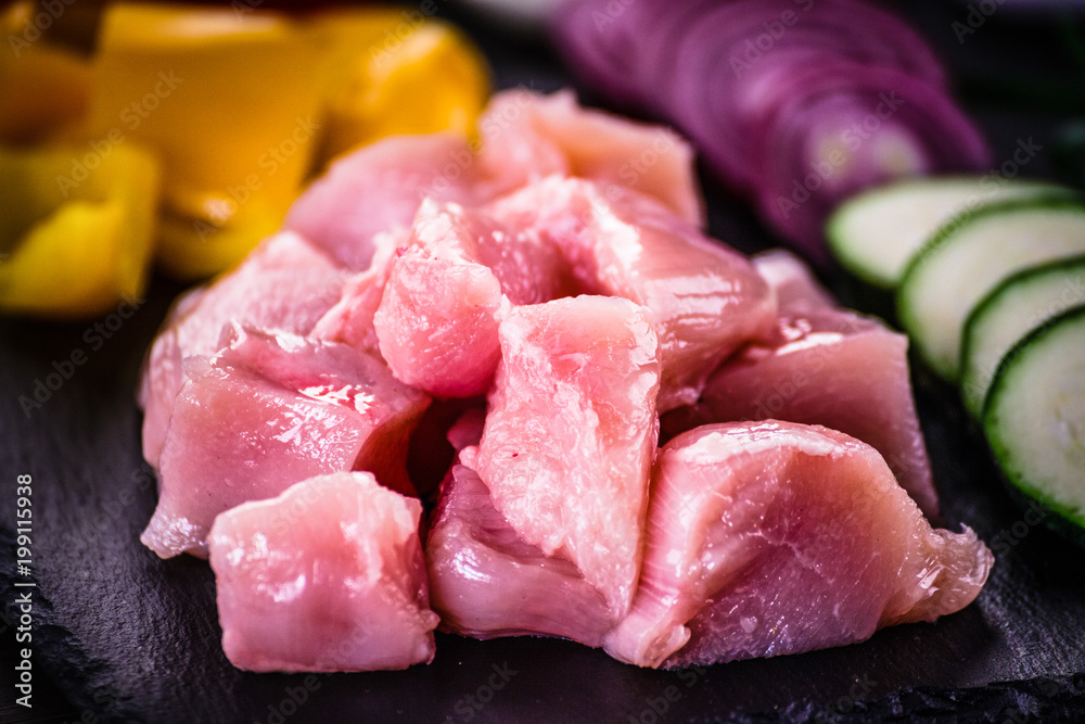 Raw chicken strips with vegetables