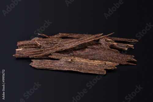 Close Up Macro Shot Of Sticks Of Agar Wood Or Agarwood Isolated On Black Background The Incense Chips Used By Burning It Or For Arabian Oud Oils Or Bakhoor