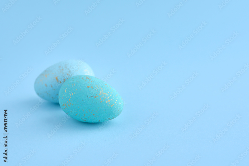 Easter eggs on blue background with empty space Easter eggs on blue background with empty space