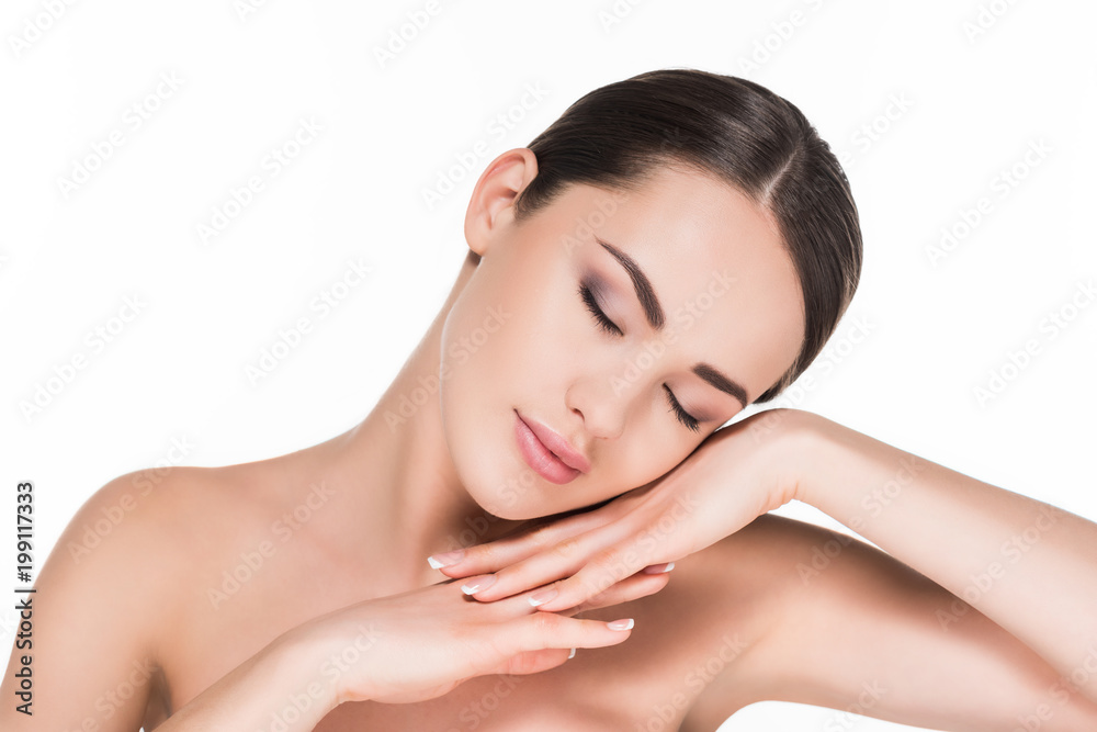 attractive young woman with eyes shut lying on hands isolated on white attractive young woman with eyes shut lying on hands isolated on white