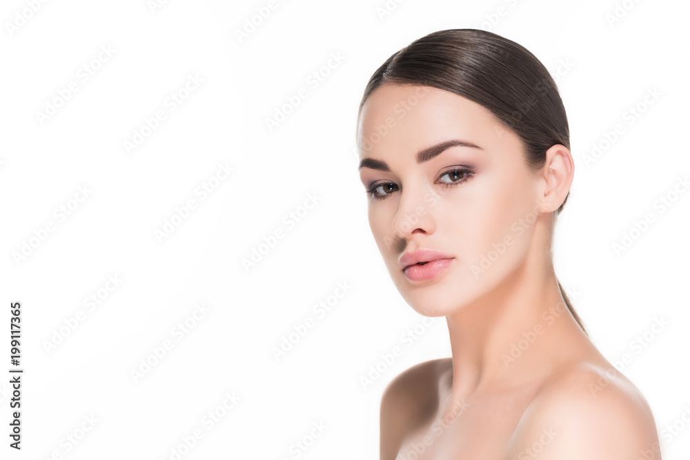 attractive young woman with simple makeup looking at camera isolated on white