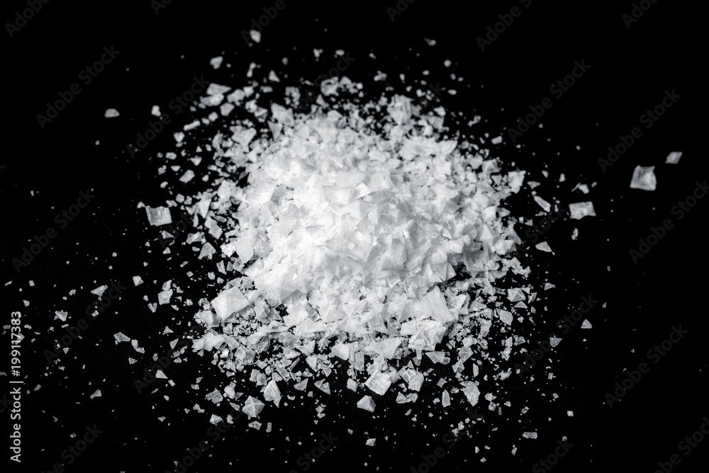 Sea flake salt isolated on black background Sea flake salt isolated on black background