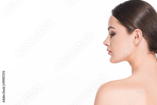 side view of young woman with perfect skin isolated on white